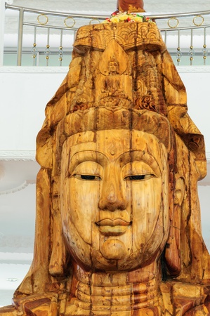 A beautiful wood statue of The Goddess of compassion and mercy in Chonburi, Thailand のeditorial素材