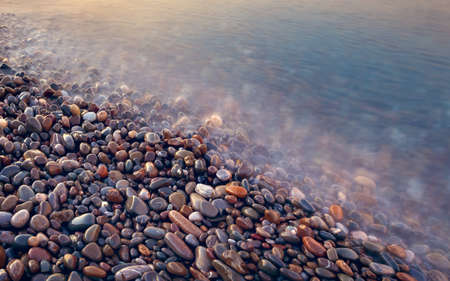 pebbles in sea vintage style long exposure abstract backgroundの写真素材