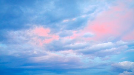 Beautiful colorful sunrise with dramatic clouds and sun shining in vintage style panorama