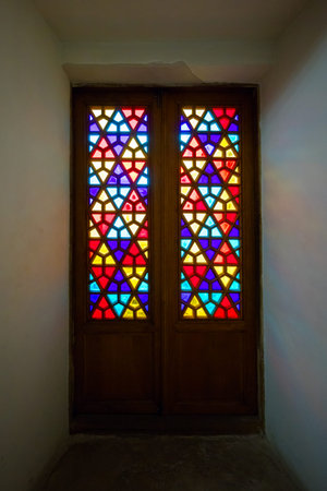 Eastern stained-glass windows, old glass doors with colored stained glass. Oriental ornament