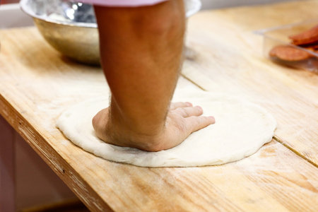 pizza prepare dough hand topping