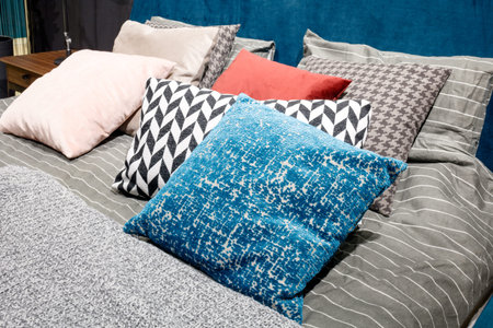 luxury modern style bedroom in gray, pink and blue tones, Interior of a bedroom cushions with a...
