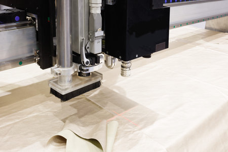 CNC machine for cutting fabrics textile materials and leather, laser marking and measurement. Modern...