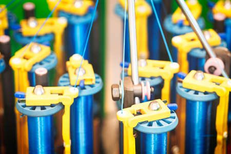 Rolls of industrial cotton fabric for clothing cloth textile manufacture on machineの写真素材