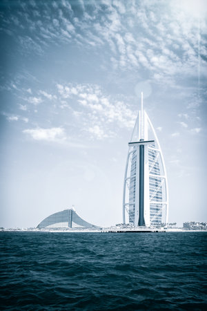 Burj Al Arab hotel on Jumeirah beach in Dubai, UAE, 25.04.2018. modern architecture, luxury beach resort, summer vacation and tourism concept.のeditorial素材