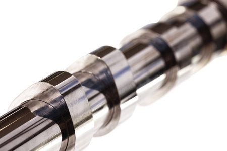 Car camshaft on white.  Industrial concept. close-up, engineering, service concept, industrial...