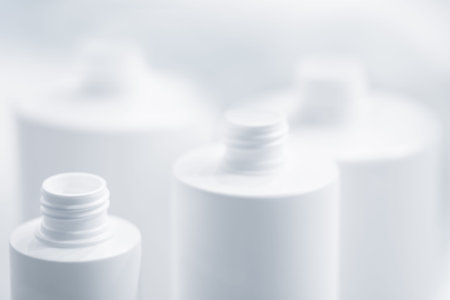 close up of a white bottle on white background