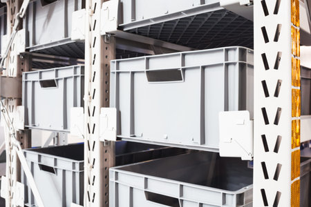 Plastic containers on the modern warehouse for piece small storage of goods