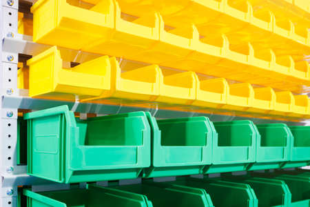 Plastic containers on the modern warehouse for piece small storage of goodsの写真素材
