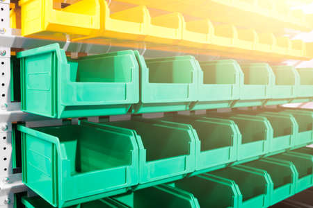 Plastic containers on the modern warehouse for piece small storage of goodsの写真素材