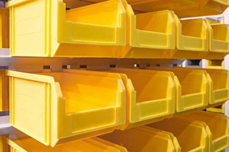 Plastic containers on the modern warehouse for piece small storage of goodsの写真素材