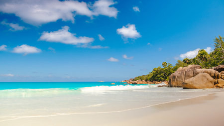 Palm and tropical beach panorama. Anse Lazio beach at Praslin island, Seychelles