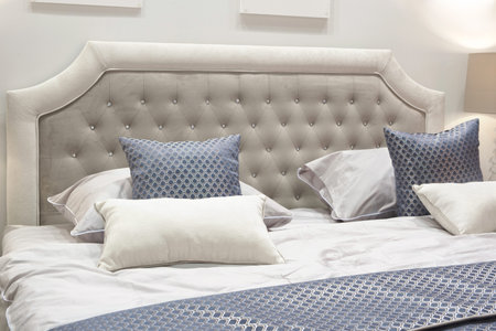 classic interior design bedroom gray and blue, Interior of a bedroom with cushions