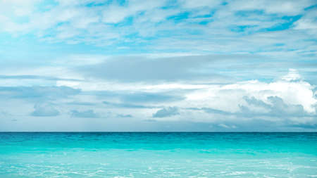 blue sea and cloudy sky over itの写真素材