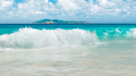 Blue ocean wave on sandy beachの写真素材