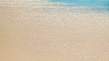 Blue ocean wave on sandy beach, sea water background, vacation conceptの写真素材