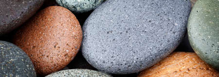 Web banner abstract smooth round wet pebbles sea texture background, spa conceptの写真素材