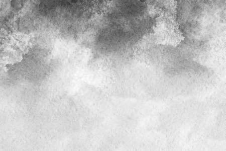 Abstract black and white watercolor background.The splashing in the paper.It is a hand drawn.の写真素材
