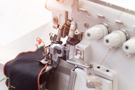 technology, manufacturing, handcraft concept. close up of the most important details in sewing...
