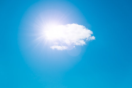 Sun and white cloud in the blue sky, sky background with space for text web banner