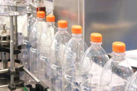 Bottle. Industrial production of plastic pet bottles. Factory line for manufacturing polyethylene...