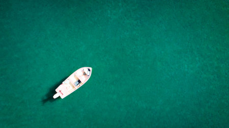 aerial drone view from the top to the blue lagoon with azure sea water with a boat with copy space, vacation conceptの写真素材