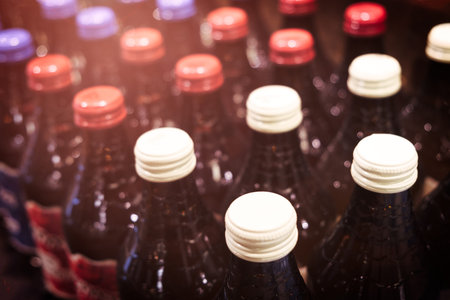 Rows of water, beer, juice, alcohol bottles in a row at the supermarketの写真素材