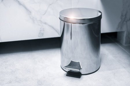 Trash bin in a bathroom, cleaning concept