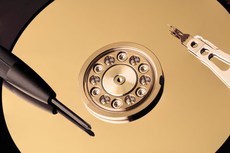 Disassembled hard drive from the computer, hdd with mirror effect. Opened hard drive from the...