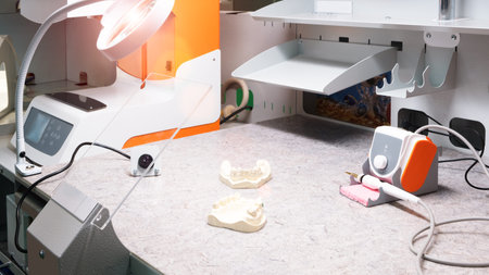 Dental technician or dentist workplace with tooth dentures  laboratory