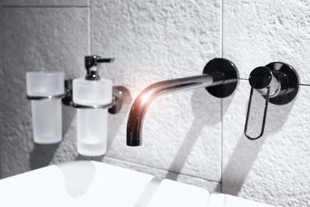 Bathroom interior with sink and faucetの写真素材