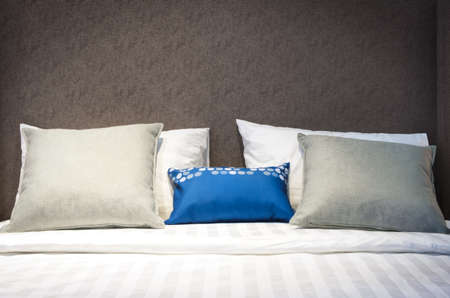 classic interior design bedroom beige gray and blue, Interior of a bedroom with cushions の写真素材