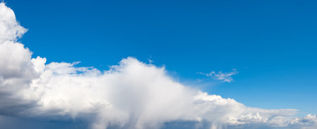 Blue sky panorama with white clouds and sun  rays. Summer spring heaven concept. Background for...