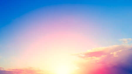 Beautiful blazing sunset landscape at over the meadow and orange sky above it. Amazing summer sunrise as a background. の写真素材