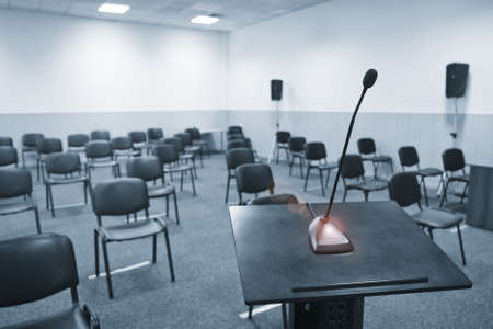 Conference table, microphones and office chairs close-upの写真素材