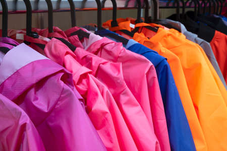 Colorful t-jacket on hangers, close up viewの写真素材