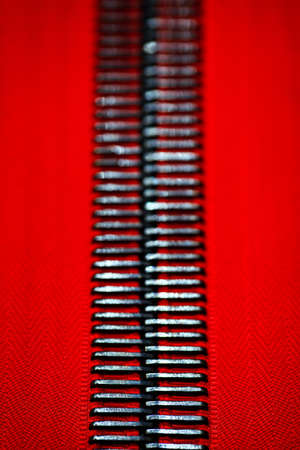 Close-up zip red background texture, hobby diy conceptの写真素材