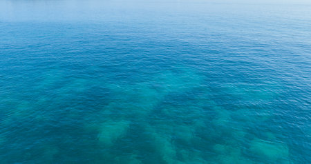 Sea blue water surface texture background, aerial view, vacation travel conceptの写真素材