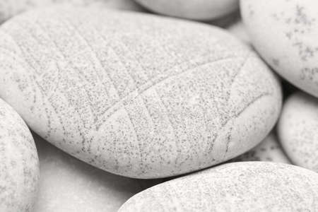 Pebbles background, abstract background with dry round gray reeble stones, gray close-up pebbles background, spa relaxation conceptの写真素材