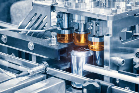 Conveyor with beer cans on the belt.Shop for the production of beer drinkの写真素材