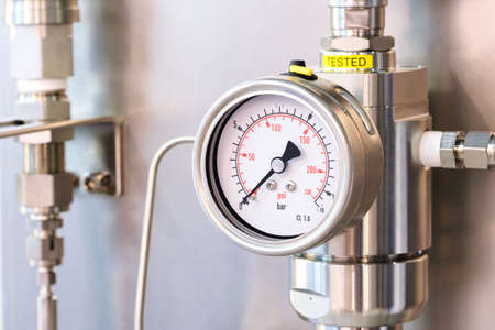 Stainless steel pipes in the factory. Construction on food production, Abstract industry background.の写真素材