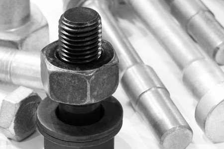 Abstract industrial textured metal background with many metal nuts and bolts