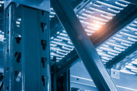 Warehouse racks metal dismountable constructions, modern warehouse technology background concept, vertical orientation, close-up with perspective, view from the bottom to topの写真素材
