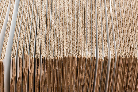 corrugated cardboard box stack in the production conveyor for packaging