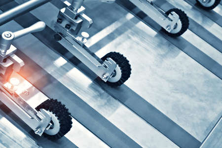 Empty conveyor rollers belt for food machinery, industrial technology manufacturing concept backgroundの写真素材