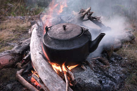 Kettle boils on fire, travel conceptの写真素材