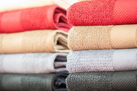 Colorful folded towels stack closeup picture.の写真素材