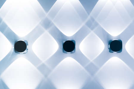 Round-shaped wicker lamps with a light bulb on the background of the wooden ceilingの写真素材