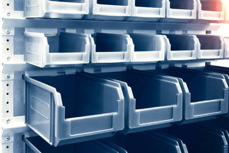 rows of multicolored plastic boxes for componentsの写真素材