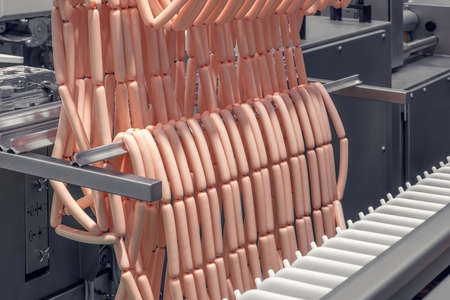 sausages production line, sausages hang in a rowの写真素材